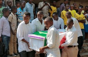 The coffin of Theogene Niyondiko, who was shot dead by police during an opposition demonstration last Friday in the Musaga neighborhood, is carried at his funeral in the capital Bujumbura, Burundi Tuesday, June 9, 2015. Civic groups in Burundi on Tuesday rejected a U.N. facilitator of talks between the government and those opposed to a third term for President Pierre Nkurunziza. (AP Photo/Gildas Ngingo)