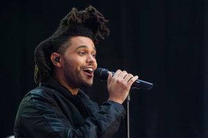 FILE - In this May 7, 2015 file photo, Abel Tesfaye, known by his stage name The Weeknd, performs on NBC's "Today" show in New York. The Weeknd and pop diva Beyonce will headline the Budweiser Made in America festival over Labor Day weekend in Philadelphia, it was announced Wednesday, June 24. Jay Zs two-day festival on Sept. 5 and 6 across Philadelphias Benjamin Franklin Parkway will also include Axwell & Ingrosso, J. Cole, Bassnectar, Modest Mouse, Big Sean, Death Cab for Cutie and Meek Mill. Tickets go on sale Monday. (Photo by Charles Sykes/Invision/AP, File)