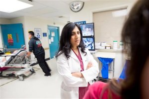 In this June 4, 2015 photo, Dr. Reena Duseja, lead author of a study on emergency room visits, stands in San Francisco General Hospital's emergency room  in San Francisco. No one wants to make a repeat visit to the emergency room for the same complaint. But new research suggests it's more common than previously thought, and people frequently wind up at a different ER the second time around.  (AP Photo/Noah Berger)