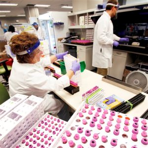 In a Jan. 18, 2012 photo, Irina Sotova and Will Clements store blood samples at Health Diagnostic Laboratory Inc. in Richmond, Va. Health Diagnostic Laboratory Inc. filed for Chapter 11 bankruptcy late Sunday night, June 7, 2015, listing between $100 million and $500 million in assets and liabilities. A hearing in U.S. Bankruptcy Court is slated for Monday to consider motions to allow for a smooth transition into bankruptcy proceedings, including payment for payroll. (Alexa Welch Edlund/Richmond Times-Dispatch via AP)