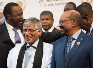 CAPTION CORRECTS THE NAME - Sudanese president Omar al-Bashir, right, stands with other African leaders during a photo op at the African Union summit in Johannesburg, Sunday June 14 2015. The High Court in Pretoria has granted an interim order preventing al-Bashir from leaving South Africa, pending an application for his arrest. (AP Photo/Shiraaz Mohamed)