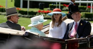 Princes Beatrice, 2nd right, with her father Prince Andrew, right, share the same carriage as Britain's Queen Elizabeth II and Prince Philip as they arrive in the parade ring on the third day of the Royal Ascot horse racing meet at Ascot, England, Thursday, June 18, 2015. The third day of Royal Ascot is traditionally known as Ladies Day, where fashion and hats come to the fore. (AP Photo/Alastair Grant)
