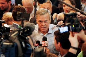 Republican presidential candidate, former Florida Gov. Jeb Bush talks to members of the media after speaking to voters at the Derry Opera House, Tuesday, June 16, 2015, in Derry, N.H. Bush is campaigning in the nation's earliest presidential primary state. (AP Photo/Jim Cole)