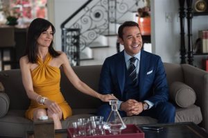 This photo provided by Warner Bros. Pictures shows, Perrey Reeves, left, as Mrs. Ari, and Jeremy Piven as Ari Gold, in Warner Bros. Pictures,' Home Box Office's and RatPac-Dune Entertainment's comedy "Entourage," a Warner Bros. Pictures release. (Claudette Barius/Warner Bros. Pictures via AP)
