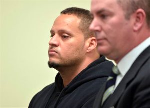 FILE - In this Feb. 26, 2014, file photo, Hugo Hesny, left, a security guard for pop singer Justin Bieber, stands beside his lawyer Andrew Schwartz during an appearance in Fulton County Magistrate Court in Atlanta. Hesny, 33, was ordered Tuesday, June 23, 2015, to serve 45 days in jail. Hesny told police he took a camera from a photographer. Under a deal reached with prosecutors, he pleaded no contest last week to two misdemeanor counts of disorderly conduct, according to court records. (AP Photo/Atlanta Journal-Constitution, Kent D. Johnson, File)