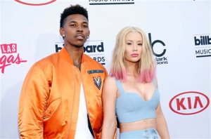 FILE - In this May 17, 2015 file photo, Nick Young, left, and Iggy Azalea arrive at the Billboard Music Awards at the MGM Grand Garden Arena in Las Vegas.  Young proposed to the rapper late Monday, June 1, as they celebrated Youngs 30th birthday. A short video of Azalea saying yes as Young proposed on bended knee was posted on the blog site Karen Civil. The site confirmed its authenticity via email. Azalea will be 25 on Sunday. (Photo by Eric Jamison/Invision/AP, File)