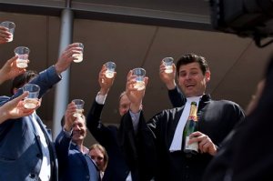 Urgenda Foundation lawyer Roger Cox, right, proposes a toast on the steps of the court house in a scene setup by TV in The Hague, Netherlands, Wednesday, June 24, 2015. A Dutch court has ordered the government to cut the country's greenhouse gas emissions by at least 25 percent by 2020 in a groundbreaking climate case that activists hope will set a worldwide precedent. The Hague District Court made the ruling Wednesday in a case brought by a sustainability organization on behalf of some 900 citizens, claiming that the the government has a duty of care to protect its citizens against looming dangers. (AP Photo/Peter Dejong)