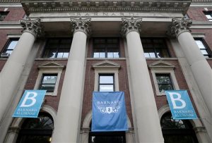 In this Thursday, May 28, 2015 photo, banners hang from a building at Barnard College in New York. Barnard, like other women's colleges, has always admitted only students born as women, but the class of 2020 may be different. Soon Barnard's trustees vote on whether to officially admit transgender students _ trans women, trans men or those not identifying with either gender _ following new policies announced at several other womens colleges. (AP Photo/Seth Wenig)