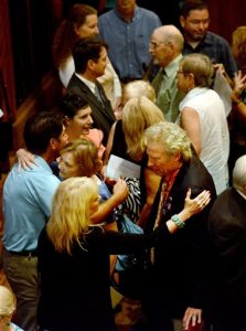 Alison Parker's parents Andy, right, and Barbara Parker, center, hugging, following the interfaith prayer service at the Jefferson Center in Roanoke, Va., on Sunday, Aug. 30, 2015. Community religious leaders gathered Sunday to remember 24-year-old reporter Alison Parker and 27-year-old cameraman Adam Ward, the two television journalists who were shot and killed while working last week. (Natalee Waters/The Roanoke Times via AP)