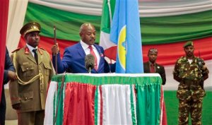 Burundi's President Pierre Nkurunziza is sworn in for a third term at a ceremony in the parliament in Bujumbura, Burundi, Thursday, Aug. 20, 2015. Without any fanfare or even a public announcement beforehand, Nkurunziza was sworn in for a third term on Thursday in this central African country which has been plagued by political violence that has left more than 100 people dead and tens of thousands of refugees. (AP Photo/Gildas Ngingo)