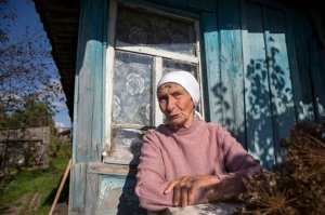 Galina Shalygina, 85, sits in front of her house after voting, in the village of Seltso, near Kostroma, 350 km (218 miles) northeast of Moscow, Russia, Sunday, Sept. 13, 2015. Voters are casting ballots across Russia for local legislators and governors, in elections expected to be won by candidates loyal to President Vladimir Putin. Sundays elections are being seen as a dress rehearsal for next years vote for a national parliament, and the anti-Putin opposition was allowed to run in only one Russian region, Kostroma. (AP Photo/Pavel Golovkin)