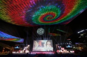 A screen shows Afghanistan actress Marina Golbahari, right, and South Korean actor Song Kang-ho on the eve of the opening ceremony of the Busan International Film Festival at Busan Cinema Center in Busan, South Korea. Wednesday, Sept. 30, 2015. Asia's largest movie festival kicks off Thursday at a time when the region's influence on the global movie industry is on the rise.(AP Photo/Ahn Young-joon)
