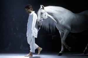 French fashion designer Simon Porte leads a horse on the catwalk, during Jacquemus' Spring-Summer 2016 ready-to-wear fashion collection, in Paris, Tuesday, Sept. 29, 2015. (AP Photo/Thibault Camus)
