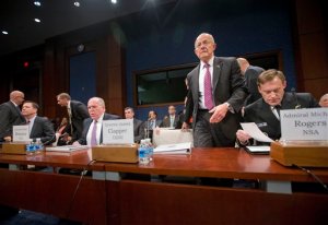 Director of National Intelligence James Clapper, center, takes his seat on Capitol Hill in Washington, Thursday, Sept. 10, 2015, prior to testifying House Intelligence Committee hearing on cyber threats. From left are, FBI Director James Comey, CIA Director John Brennan, and Clapper, and Director of the National Security Agency Adm. Michael Rodgers.  (AP Photo/Pablo Martinez Monsivais)