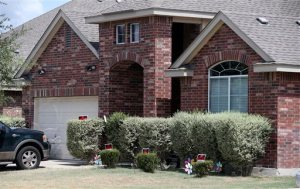 No trespassing signs are visible at the house Tuesday, Sept. 1, 2015, where deputies fatally shot Gilbert Flores, in Northwest Bexar County, Texas, near San Antonio, last Friday. A Texas prosecutor says a second video has emerged that gives authorities a very clear view of a confrontation between deputies and Flores who had his hands raised before he was shot and killed. (John Davenport/The San Antonio Express-News via AP) RUMBO DE SAN ANTONIO OUT; NO SALES; MANDATORY CREDIT