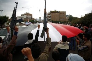Shiite rebels known as Houthis hold up their weapons as they chant slogans during a rally to protest Saudi-led airstrikes, in Sanaa, Yemen, Monday, Aug. 24, 2015. The Saudi-led coalition fighting Shiite rebels in Yemen doubled its near-daily airstrikes in the central province of Marib and the adjacent border area of Jawf on Monday, paving the way for allies on the ground to push north toward Shiite rebel strongholds, military and security officials said. (AP Photo/Hani Mohammed)