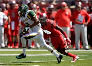 Norfolk State wide receiver DeAndre Sangster (8) runs with the ball as  Rutgers defensive back Blessuan Austin (10) tries to make a tackle during the first half of an NCAA college football game Saturday, Sept. 5, 2015, in Piscataway, N.J. (AP Photo/Mel Evans)
