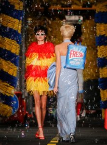 Models wears creations for Moschino women's spring-summer 2016 collection, part of the Milan Fashion Week, unveiled in Milan, Italy, Thursday, Sept. 24, 2015. (AP Photo/Luca Bruno)