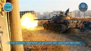 FILE - In this file image posted on a Twitter account of Syria's al-Qaida-linked Nusra Front on Tuesday, July 7, 2015, a tank from the Nusra Front fires during their clashes against the Syrian government forces at the western Zahra neighborhood in Aleppo city, Syria. A group of U.S.-trained rebels that recently returned to Syria said Wednesday it has lost contact with one of its officer but is investigating reports that it has defected and handed over his weapons to al-Qaida affiliate in the country. (Al-Nusra Front Twitter page via AP, File)