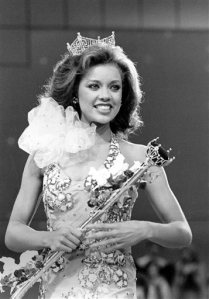 FILE - In this Sept. 17, 1983 file photo, Miss New York Vanessa Williams appears during her coronation walk after she was crowned Miss America 1984 at the Miss America Pageant in Atlantic City, N.J. The Miss America Organization, Dick Clark Productions and the ABC television network announced Tuesday, Sept. 8, 2015, that they are bringing back the actress and singer to serve as head judge for the 2016 competition. Williams won the title in 1984 but resigned after Penthouse magazine published sexually explicit photographs of her taken several years earlier. (AP Photo/Jack Kanthal, File)