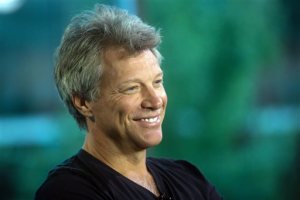 FILE - In this Aug. 22, 2015 file photo, musician Jon Bon Jovi smiles during media interviews in Vancouver, British Columbia. Bon Jovi has added a second concert in Taiwan September, 2015, after the rock group's concerts in China were abruptly canceled.  The event promoter Live Nation Taiwan announced Thursday night, Sept. 10, 2015, on Facebook the second performance would be on Sept. 29, the day after the previously scheduled concert. AEG Live Asia has declined to say why performances Sept. 14 in Shanghai and Sept. 17 in Beijing were canceled.(Darryl Dyck/The Canadian Press via AP, File)