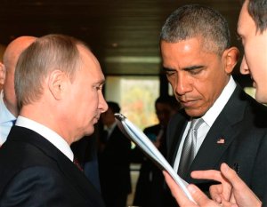 FILE _ This is a Tuesday, Nov. 11, 2014 file photo of Russian President Vladimir Putin, left, and U.S. President Barack Obama, as they talk on the sidelines of the Asia-Pacific Economic Cooperation (APEC) Summit  in Beijing.  Vladimir Putin's spokesman said Thursday Sept. 24, 2015, that  the Russian president will meet with President Barack Obama on Monday. Putin is to speak to the United Nations General Assembly that day. It's not clear whether the meeting with Obama will take place before or after the speech.  (AP Photo/RIA Novosti, Presidential Press Service, File)