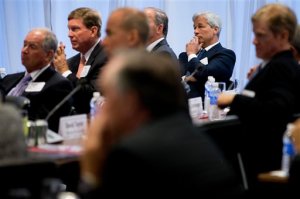 JPMorgan Chase Chairman, President and CEO Jamie Dimon, right, listens as President Barack Obama speaks to business leaders at the quarterly meeting of the Business Roundtable in Washington, Wednesday, Sept. 16, 2015, to renew his calls for increased spending in infrastructure, education and scientific research. (AP Photo/Andrew Harnik)