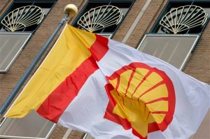 FILE - In this Monday, April 7, 2014 file photo, a flag bearing the company logo of Royal Dutch Shell, an Anglo-Dutch oil and gas company, flies outside the head office in The Hague, Netherlands. Royal Dutch Shell will cease exploration in Arctic waters off Alaska's coast following disappointing results from an exploratory well backed by billions in investment and years of work. The announcement that came on Monday, Sept. 28, 2015 was a huge blow to Shell, which was counting on offshore drilling in Alaska to help it drive future revenue. Environmentalists, however, had tried repeatedly to block the project and welcomed the news. (AP Photo/Peter Dejong, File)