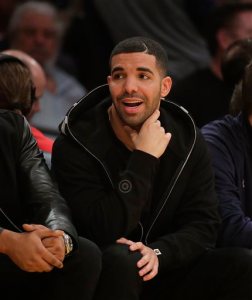 FILE - In a Nov. 30, 2014 file photo, rapper Drake attends an NBA basketball game between the Los Angeles Lakers and the Toronto Raptors, in Los Angeles. BET said Tuesday, Sept. 15, 2015, that Drake received 12 nominations for the 10th annual BET Hip-Hop Awards show. Rap veteran Snoop Dogg returns as host and is expected to perform during the show. It airs Oct. 13. (AP Photo/Jae C. Hong, File)