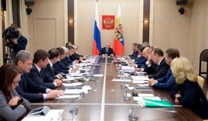 Russian President Vladimir Putin, rear center, holds a meeting with senior government officials at the Novo-Ogaryovo residence outside Moscow, Russia on Wednesday, Sept. 30, 2015. Russian military jets carried out airstrikes against the Islamic State group in Syria on Wednesday for the first time, after President Vladimir Putin received parliamentary approval to send Russian troops to Syria. (Alexei Nikolsky/RIA Novosti, Kremlin Pool Photo via AP)