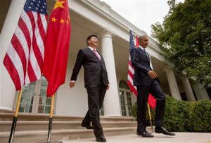 President Barack Obama and Chinese President Xi Jinping arrive for their joint news conference, Friday, Sept. 25, 2015, in the Rose Garden at the White House in Washington. (AP Photo/Evan Vucci)