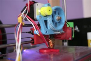 In this Monday, Sept. 7, 2015 photo, the 3D printer used to manufacture stethoscopes by Dr. Tarek Loubani, a Palestinian-Canadian doctor, is seen in Gaza City. To combat a medical supply shortage in the beleaguered Gaza Strip, a Palestinian-Canadian doctor is manufacturing stethoscopes with a 3-D printer _ and doctors say they work as well as the originals. (AP Photo/ Khalil Hamra)