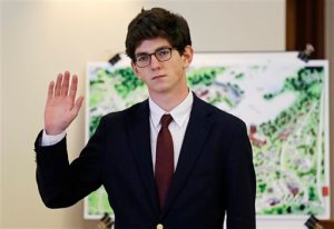 FILE - In this Aug. 26, 2015, file photo, St. Paul's School graduate Owen Labrie, 19, raises his hand to be sworn-in prior to testifying in his trial at Merrimack Superior Court in Concord, N.H. Labrie was convicted Friday, Aug. 28, 2015, of having sexual contact with a 15-year-old classmate. He will be required to register as a sex offender for life, a punishment his lawyer likened to being branded and legal experts and reform advocates said exceeds the crime. (AP Photo/Charles Krupa, Pool, File)