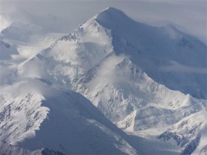 FILE - This Aug. 27, 2014 file photo, clearer skies provided this view of one of the faces of North America's tallest peak, Mount McKinley in Denali National Park and Preserve, Alaska. North America's tallest mountain will again be known by its Alaska Native name. President Barack Obama announced Sunday his administration will change the name of Mount McKinley to Denali to honor Athabascans, central Alaska Indians whose territory stretches 500 miles, from the Brooks Range south to Cook Inlet. (AP Photo/Becky Bohrer,File)