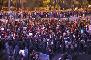 Iraqi security forces close a bridge leading to the heavily guarded Green Zone during a demonstration in support of Iraqi Prime Minister Haider al-Abadi in Tahrir Square in Baghdad, Iraq, Friday, Aug. 28, 2015. Friday's protesters were joined for the first time by followers of Muqtada al-Sadr, a radical, anti-American Shiite cleric. The protesters have staged weekly rallies since last month to press demands for reforms, better services and an end to corruption. (AP Photo/Khalid Mohammed)