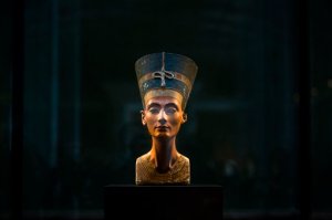 FILE - In this Sept. 10, 2014 file photo, a 3,300-year-old bust of Queen Nefertiti stands on its socle, at the New Museum in Berlin, Germany. An Egyptian official says the Antiquities Ministry gave an initial approval for the use of non-invasive radar to verify a theory that Queen Nefertitis crypt may be hidden behind King Tutankhamuns 3,300-year-old tomb in the famous Valley of the Kings. (AP Photo/Markus Schreiber, File)