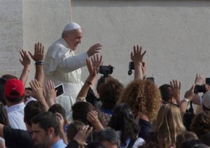 Pope Francis waves as he arrives for his weekly general audience in St. Peter's Square at the Vatican, Wednesday, Sept. 9, 2015. (AP Photo/Alessandra Tarantino)