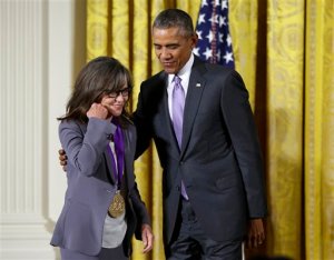 President Barack Obama awards the 2014 National Medal of Arts to actress and filmmaker Sally Field of Los Angeles, Thursday, Sept. 10, 2015, during a ceremony in the East Room of the White House in Washington. (AP Photo/Manuel Balce Ceneta)