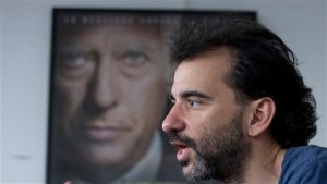 In this Wednesday, Aug. 26, 2015 photo, Argentine filmmaker Pablo Trapero talks during an interview with The Associated Press about his latest film " Tha Clan," in Buenos Aires, Argentina. The film shows the seemingly normal, church-going family interacting with victims-to-be. One of those killed played in a rugby league with Puccios son Alejandro.(AP Photo/Natacha Pisarenko)