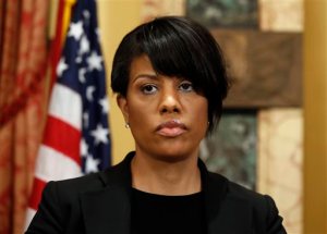FILE - In this May 1, 2015, file photo, Mayor Stephanie Rawlings-Blake prepares to speak at a media availability at City Hall in Baltimore. Rawlings-Blake said Friday, Sept. 11, 2015, she will not seek re-election nearly five months after the city erupted in rioting following the death of Freddie Gray, who was injured while in police custody. The announcement comes just days after officials said the city would pay Gray's family $6.4 million to settle civil claims over his spinal injury. (AP Photo/Alex Brandon, File)