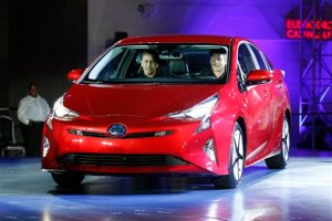 Toyota unveils the latest version of the Prius at an event Tuesday, Sept. 8, 2015, in Las Vegas. The car is still the No. 1 hybrid on the market but has been a tougher sell for dealers with gas prices below $3 in many areas of the country. (AP Photo/John Locher)