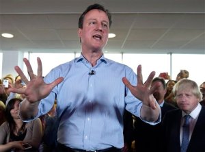 FILE - This is a Tuesday May 5, 2015 file photo of Britain's Prime Minister and Conservative Party leader David Cameron as he speaks at an election rally in Hendon in north London. British Prime Minister David Cameron's university days at Oxford are in the news Monday Sept. 21, 2015 thanks to a new book by a former Conservative Party treasurer Michael Ashcroft, who donated millions to the party before falling out with Cameron, has co-written "Call Me Dave," an unauthorized biography that includes allegations of drug-taking and juvenile sexual escapades. (Toby Melville, Pool Photo via AP, File)