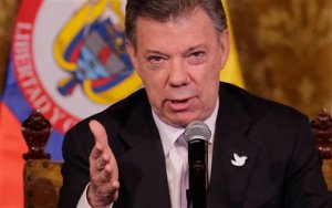 In this Sept. 21, 2015 photo, Colombia's President Juan Manuel Santos talks in Quito, Ecuador. Santos has announced a surprise trip Wednesday to Cuba for a key meeting with government peace negotiators trying to wrap up talks aimed at ending the countrys long-running conflict. (AP Photo/Dolores Ochoa)