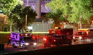 Fire units and ambulances line up to transport injured concert goers at Tempe Beach Park Saturday, Sept. 26, 2015 in Tempe, Ariz. An Arizona music festival is set to resume for a Kanye West performance after as many as 12 people were injured when a crowd rushed a stage, officials said Sunday. (David Kadlubowski/The Arizona Republic via AP) MARICOPA COUNTY OUT; MAGS OUT; NO SALES; MANDATORY CREDIT