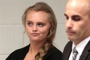 FILE - In this Aug. 24, 2015 file photo, Michelle Carter listens to defense attorney Joseph P. Cataldo argue for an involuntary manslaughter charge against her to be dismissed at Juvenile Court in New Bedford, Mass. Carter, 18, of Plainville, Mass., is charged with involuntary manslaughter for allegedly pressuring Conrad Roy III, 18, of Fairhaven, Mass., to commit suicide on July 13, 2014. (Peter Pereira/The New Bedford Standard Times via AP, Pool, File)