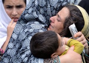 In this Wednesday, Aug. 5, 2015 photo, family members of Shafqat Hussain, who was convicted and hanged for killing a boy, mourn his death in Muzaffarabad, Pakistani Kashmir. Pakistan quickly has become one of the worlds top executioners following a Taliban attack on a military school after years of not carrying out a death sentence, but instead of killing militants, it routinely executes common criminals, The Associated Press has found. (AP Photo/M.D. Mughal)