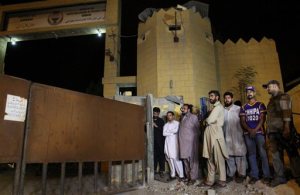 FILE - In this Tuesday,  Aug. 4, 2015 file photo, family members of Shafqat Hussain, who was convicted and hanged for killing a boy, wait to receive his body outside the central jail in Karachi, Pakistan. Pakistan quickly has become one of the worlds top executioners following a Taliban attack on a military school after years of not carrying out a death sentence, but instead of killing militants, it routinely executes common criminals, The Associated Press has found. (AP Photo/Fareed Khan,file)
