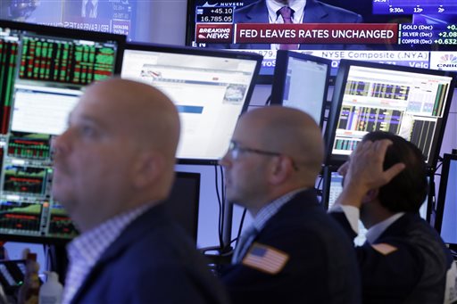 Stocks close lower after Fed keeps interest rates&nbsp;low