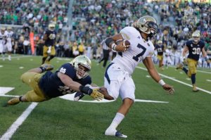 Georgia Tech's Patrick Skov gets past Notre Dame linebacker Greer Martini (48) to score a touchdown during the second half of an NCAA college football game in South Bend, Ind., Saturday, Sept. 19, 2015. Notre Dame defeated Georgia Tech 30-22. (AP Photo/Michael Conroy)