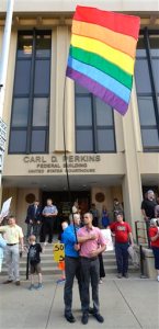 Jonathan Beebe-Franqui, right, and his husband Dwayne D. Beebe-Franqui embrace as they wait for the arrival of Rowan County Clerk Kim Davis at the Carl D. Perkins Federal Building in Ashland, Ky., Thursday, Sept. 3, 2015. Davis has been ordered to appear in Federal Court to explain why she is refusing to issue marriage licenses despite a federal order to do so. (AP Photo/Timothy D. Easley)